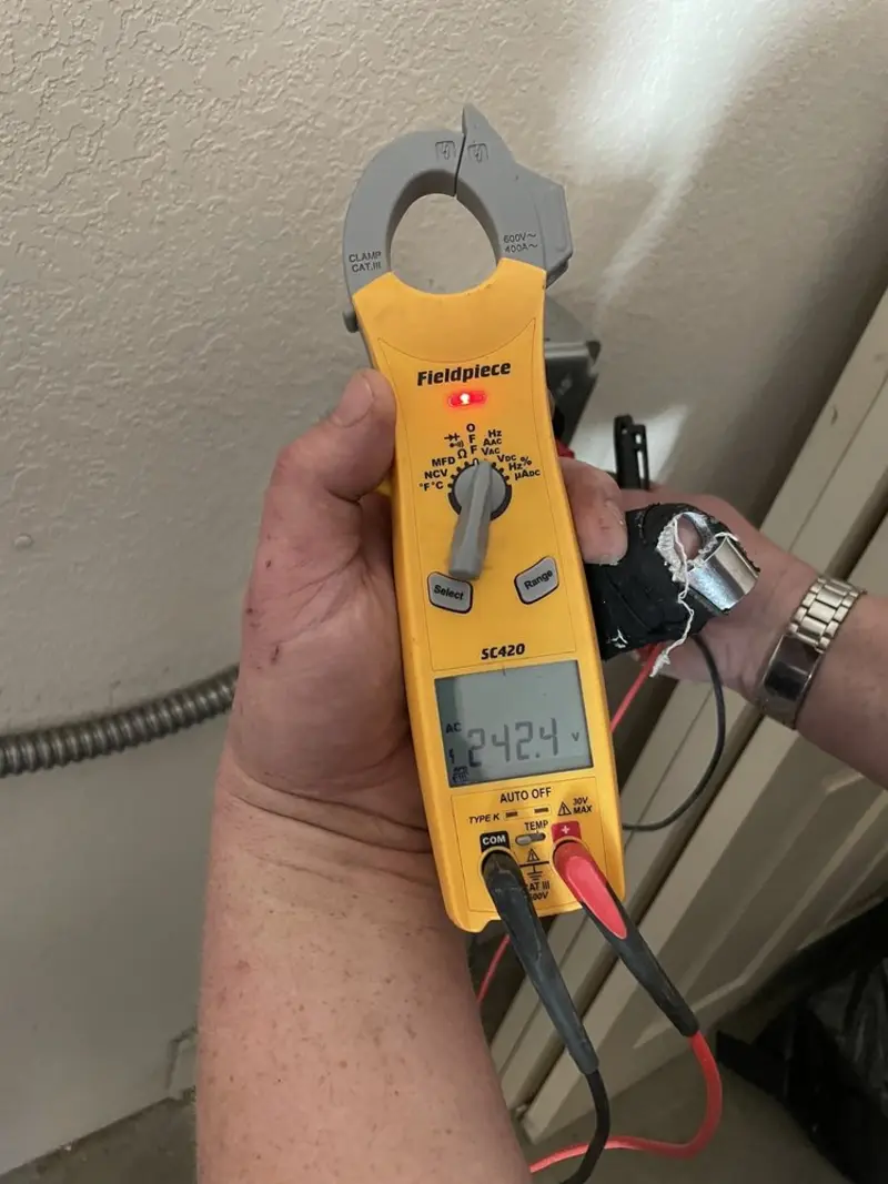 Voltage testing with clamp meter during Electrical Installation Services in Gibsonville